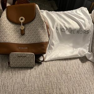 Michael Kors Backpack Purse with matching wallet.
